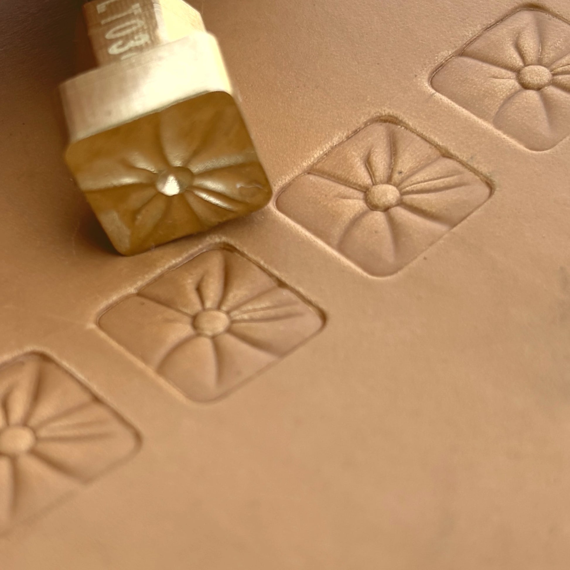 Geometric leather stamp LT034 — brass stamping tool with imprint on natural veg-tan leather