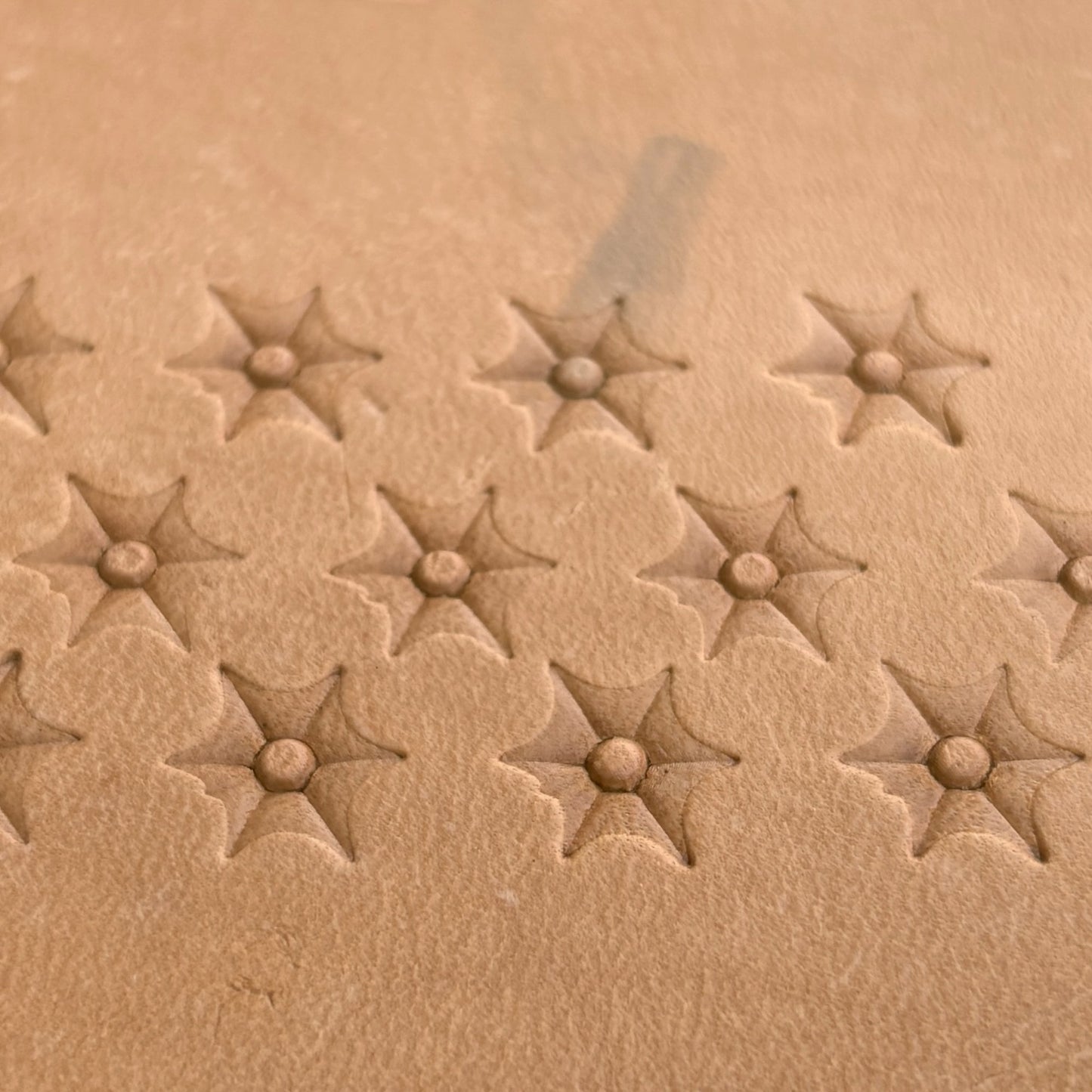 Starburst leather stamp LT035 — pattern imprint on veg-tan leather