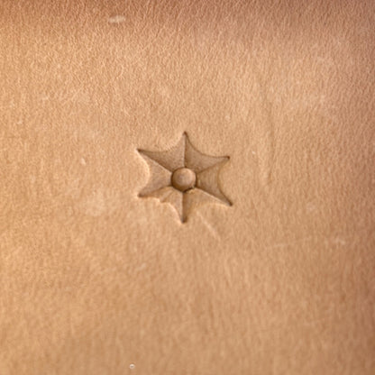 Starburst leather stamp LT035 — single impression on veg-tan leather