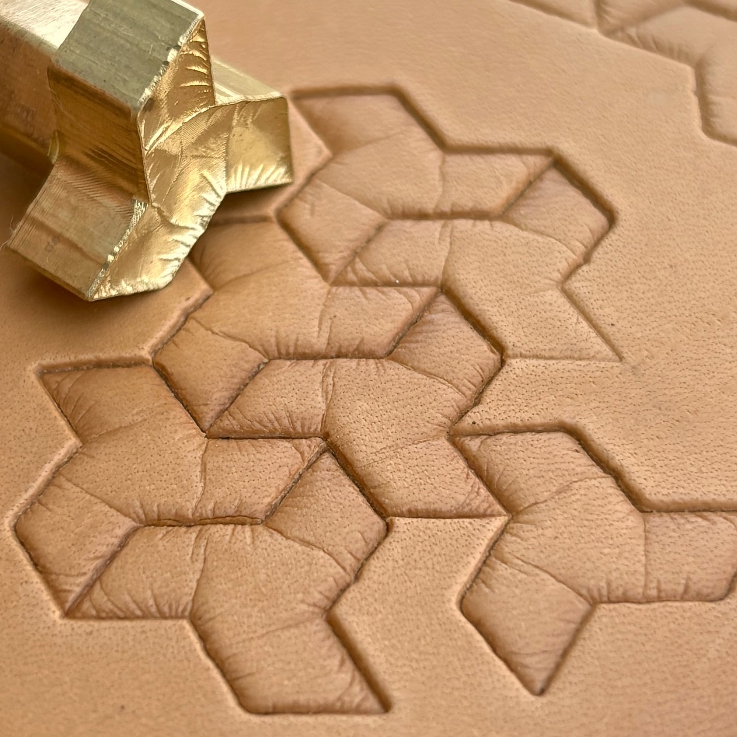 Geometric leather stamp LT036 — brass stamping tool with imprint on natural veg-tan leather