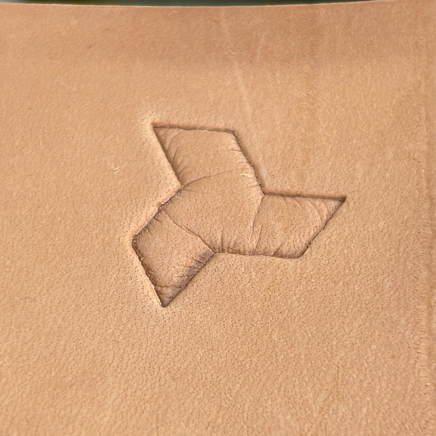 Geometric leather stamp LT036 — single impression on veg-tan leather