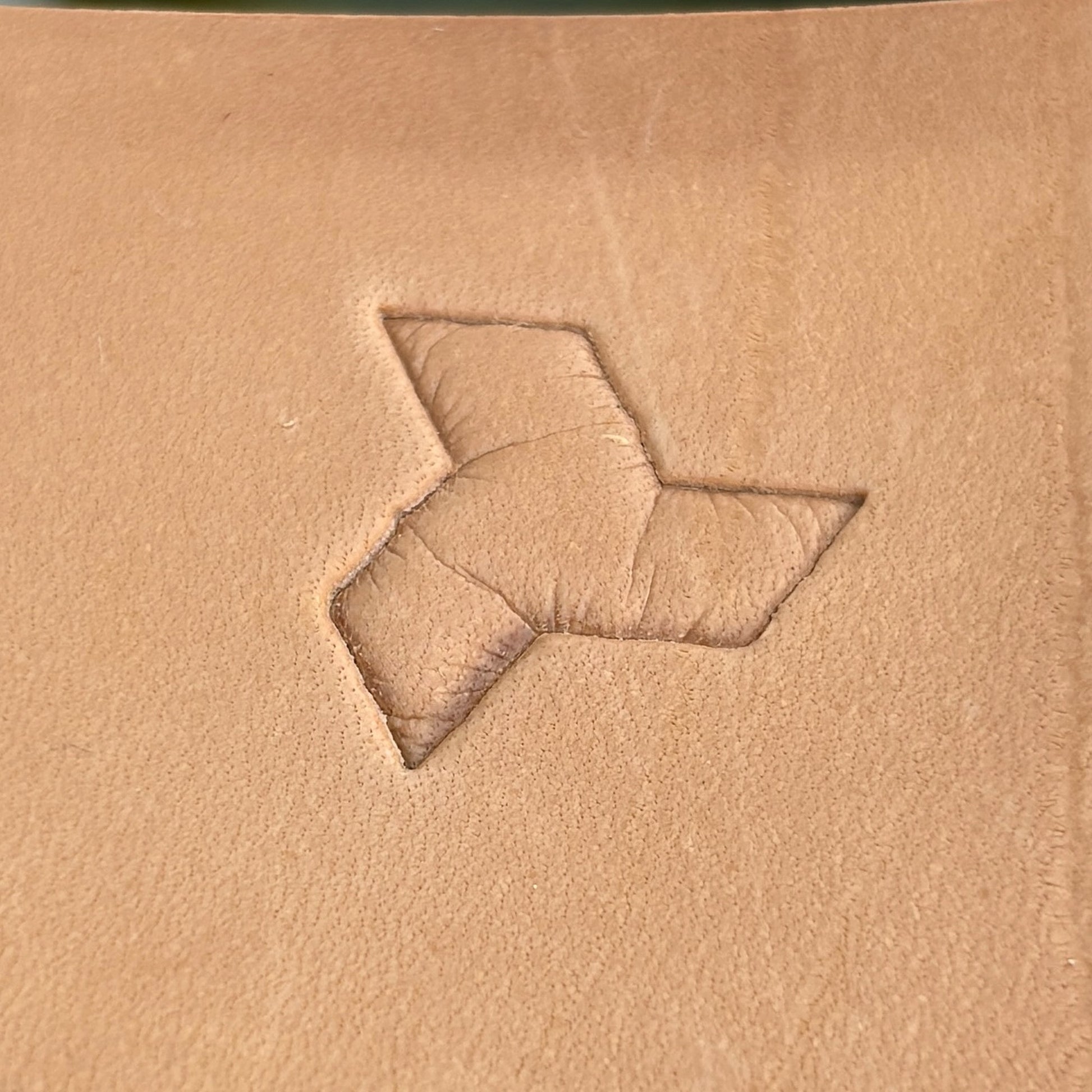 Geometric leather stamp LT036 — single impression on veg-tan leather