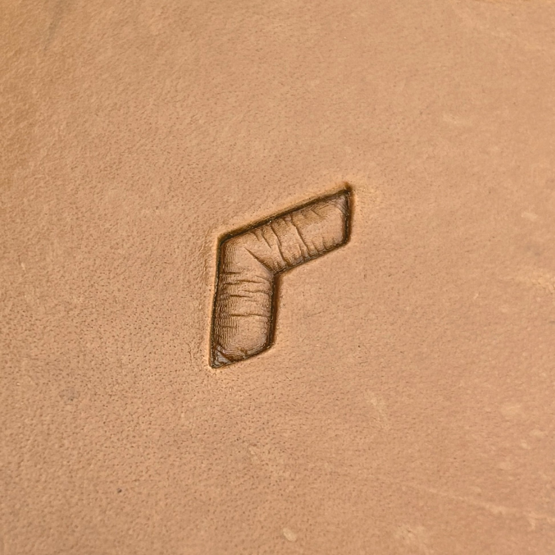 Geometric leather stamp LT037 — single impression on veg-tan leather