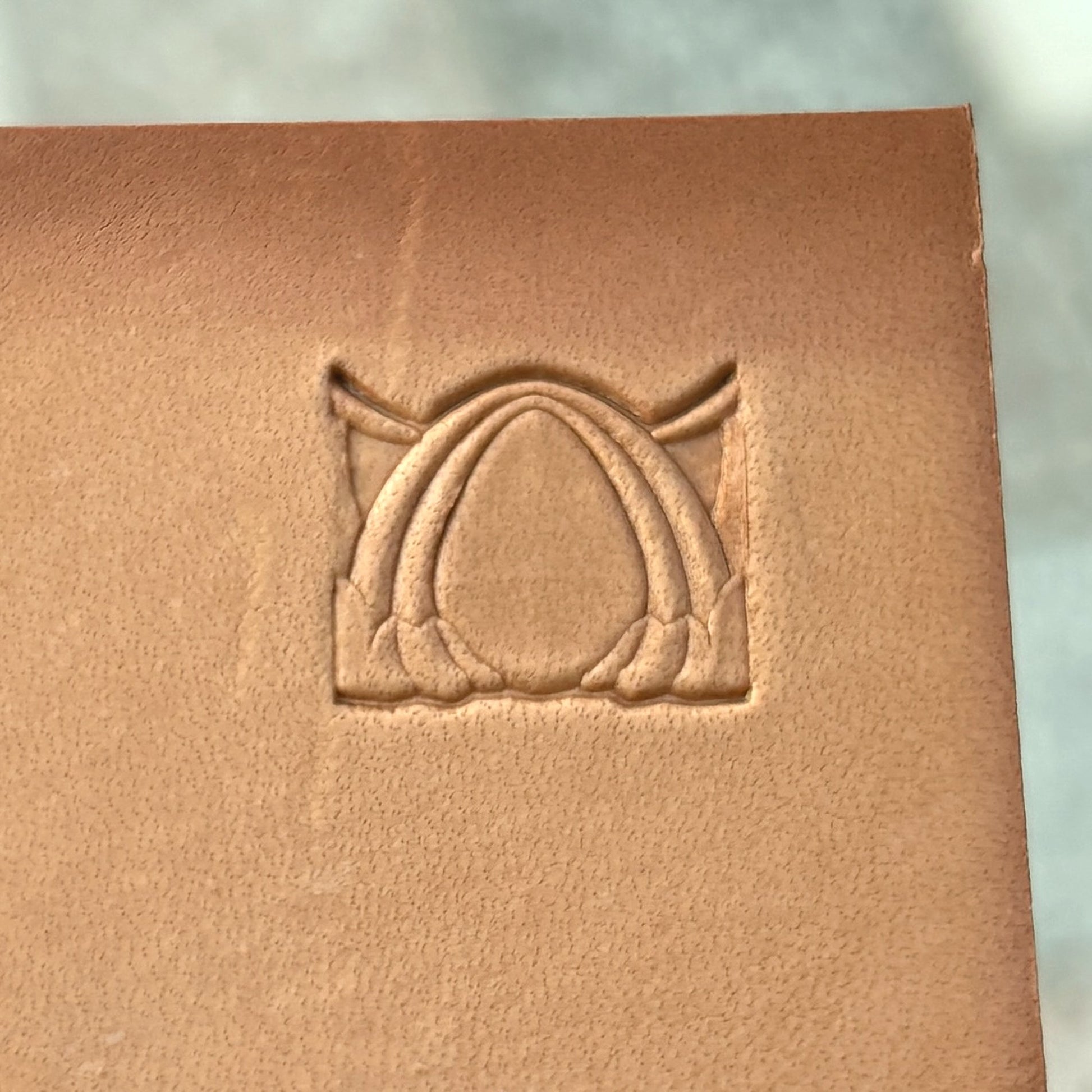 Art Deco leather stamp LT040 — single impression on veg-tan leather