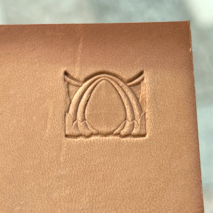 Art Deco leather stamp LT040 — single impression on veg-tan leather