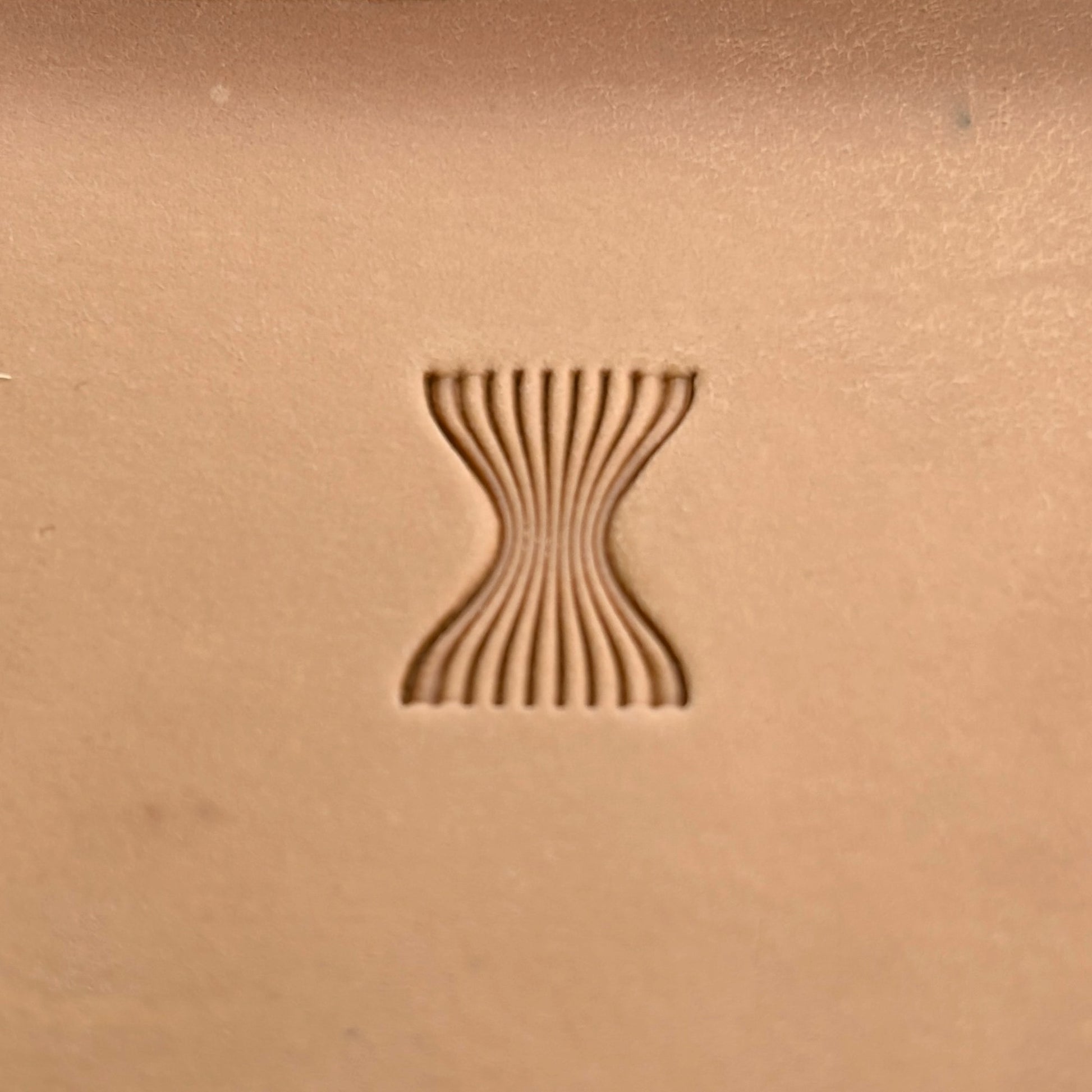 Wavy Lines leather stamp LT044 — single impression on veg-tan leather