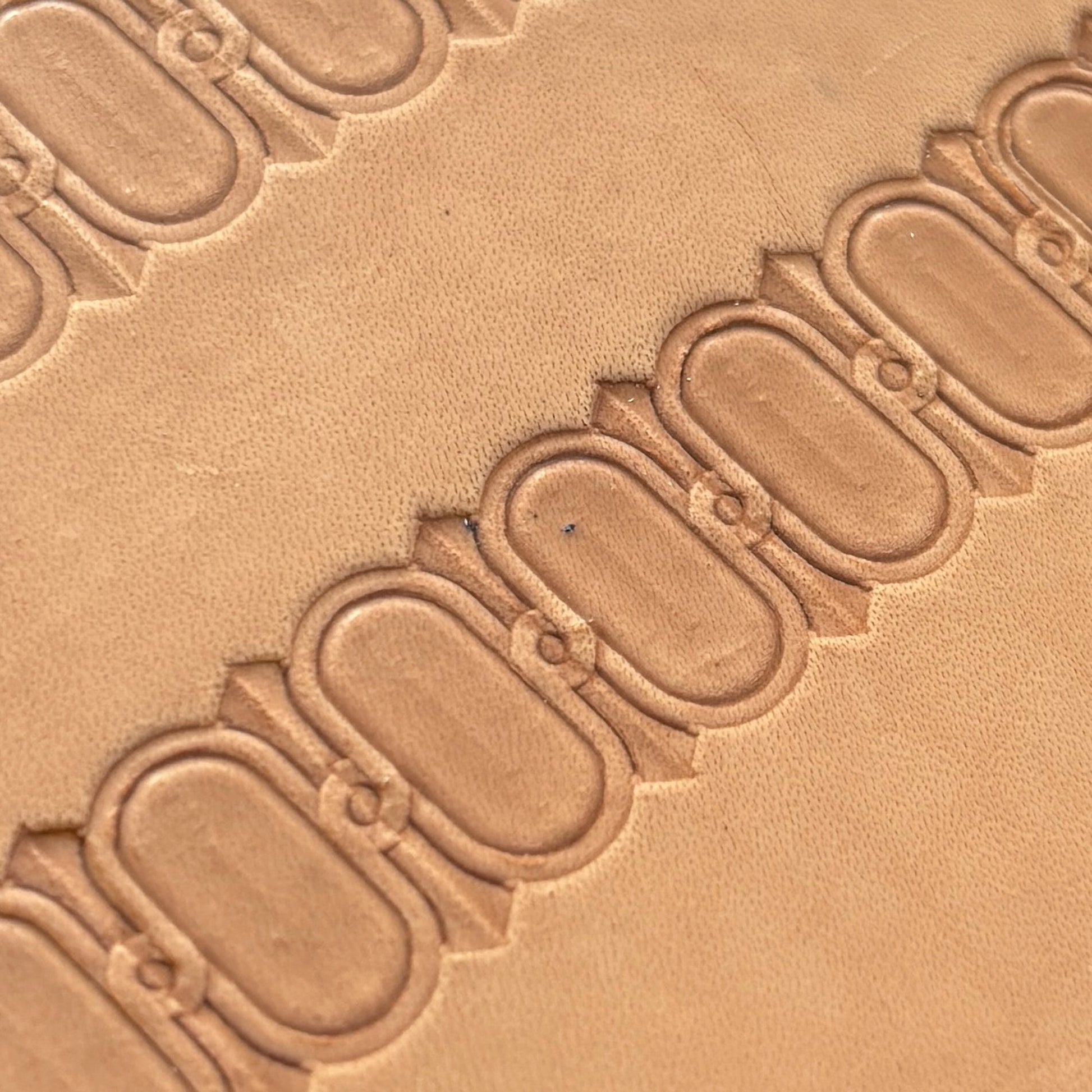 Oval Border leather stamp LT045 — pattern imprint on veg-tan leather