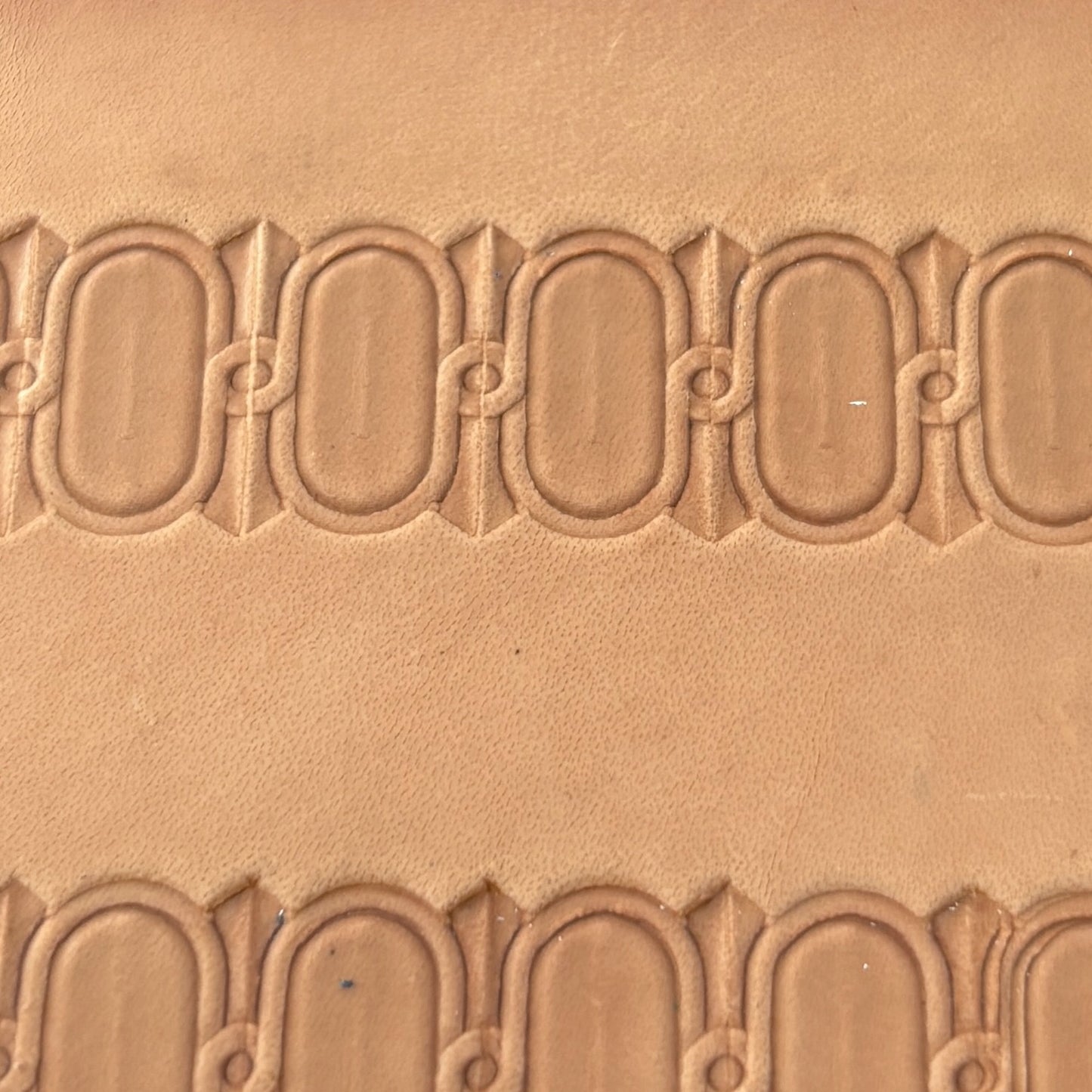 Oval Border leather stamp LT045 — pattern imprint on veg-tan leather