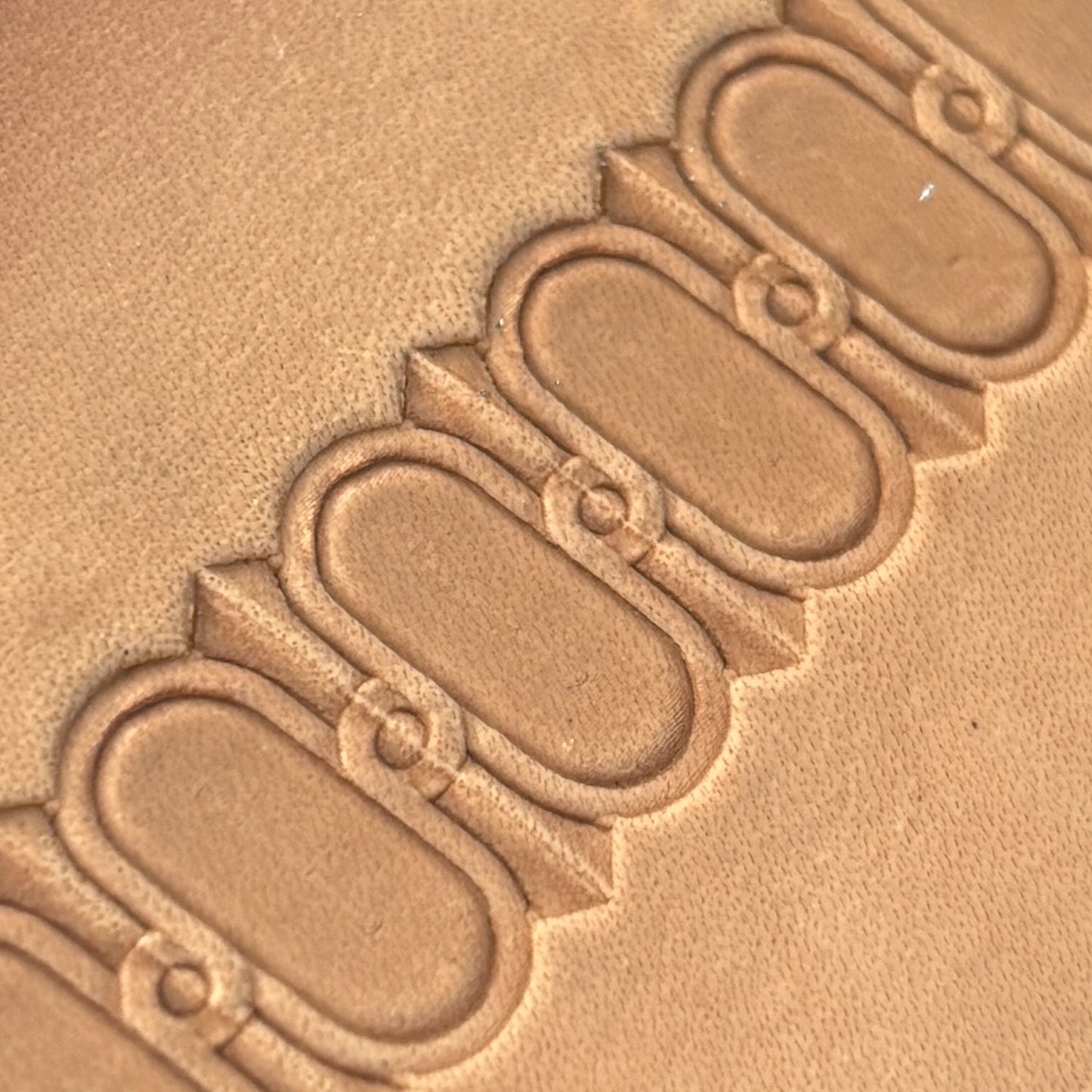 Oval Border leather stamp LT045 — pattern imprint on veg-tan leather