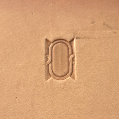 Oval Border leather stamp LT045 — single impression on veg-tan leather