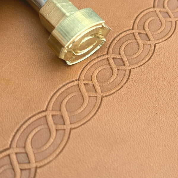 Geometric leather stamp LT047 — brass stamping tool with imprint on natural veg-tan leather