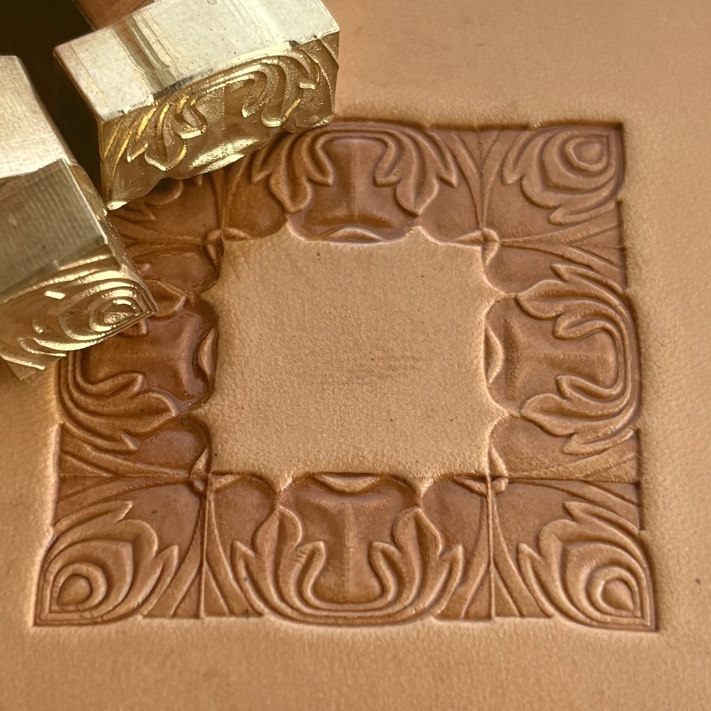 Ornate Border + Corner leather stamp LT052 — brass stamping tool with imprint on natural veg-tan leather
