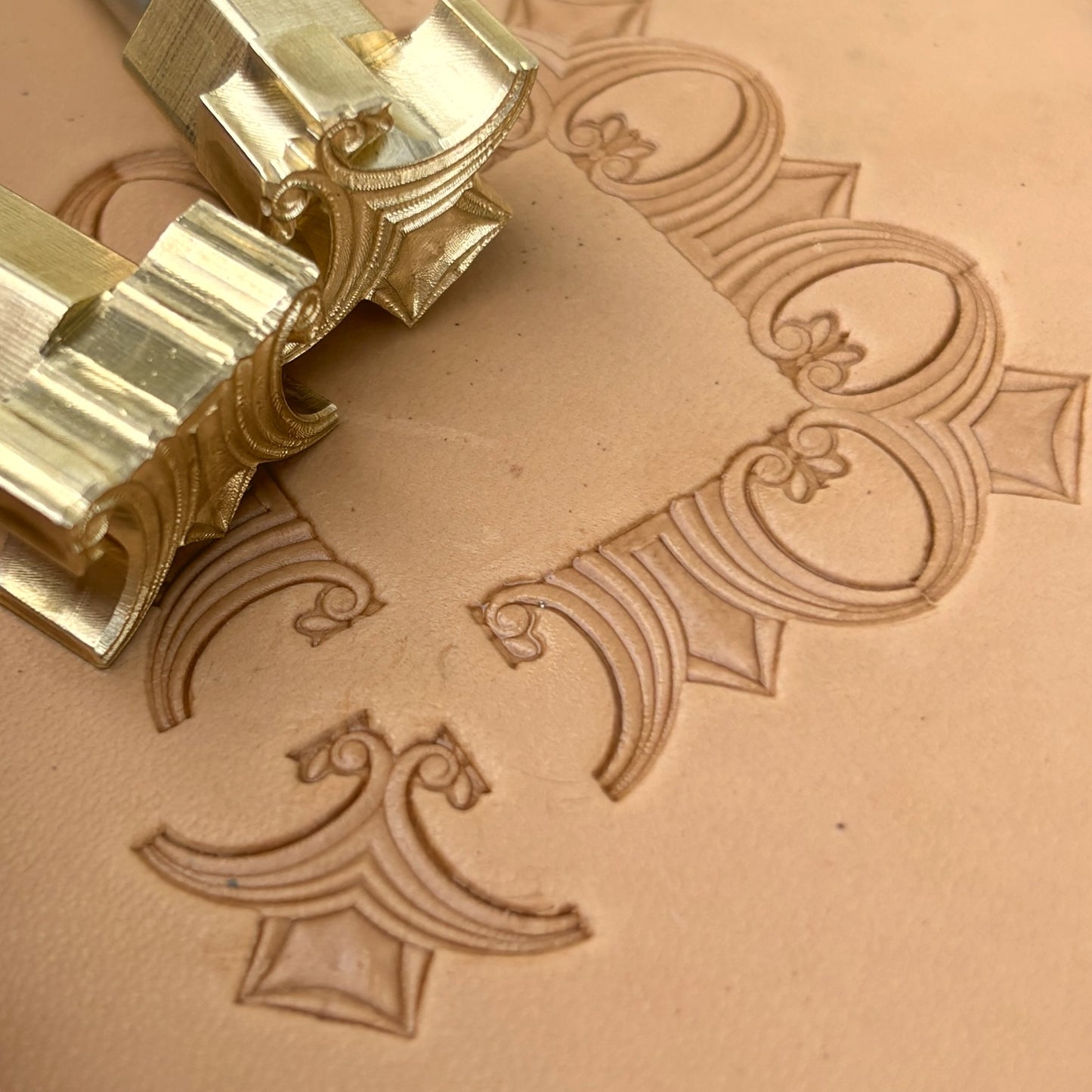 Art Deco Geometric leather stamp LT053 — brass stamping tool with imprint on natural veg-tan leather