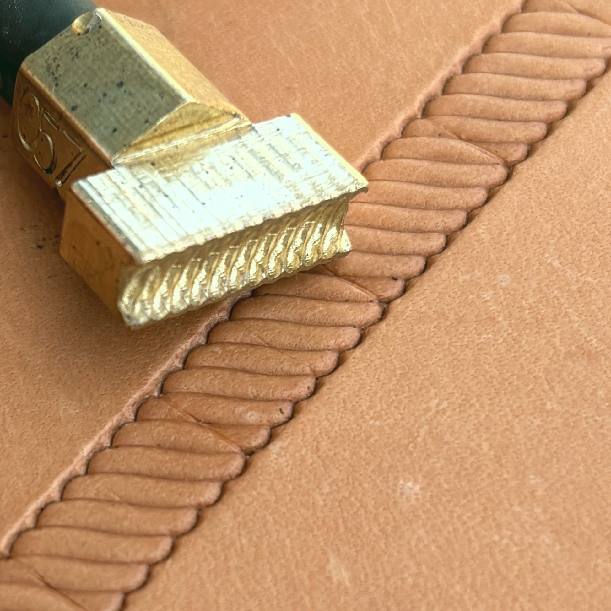 Stitches leather stamp LT057 — brass stamping tool with imprint on natural veg-tan leather