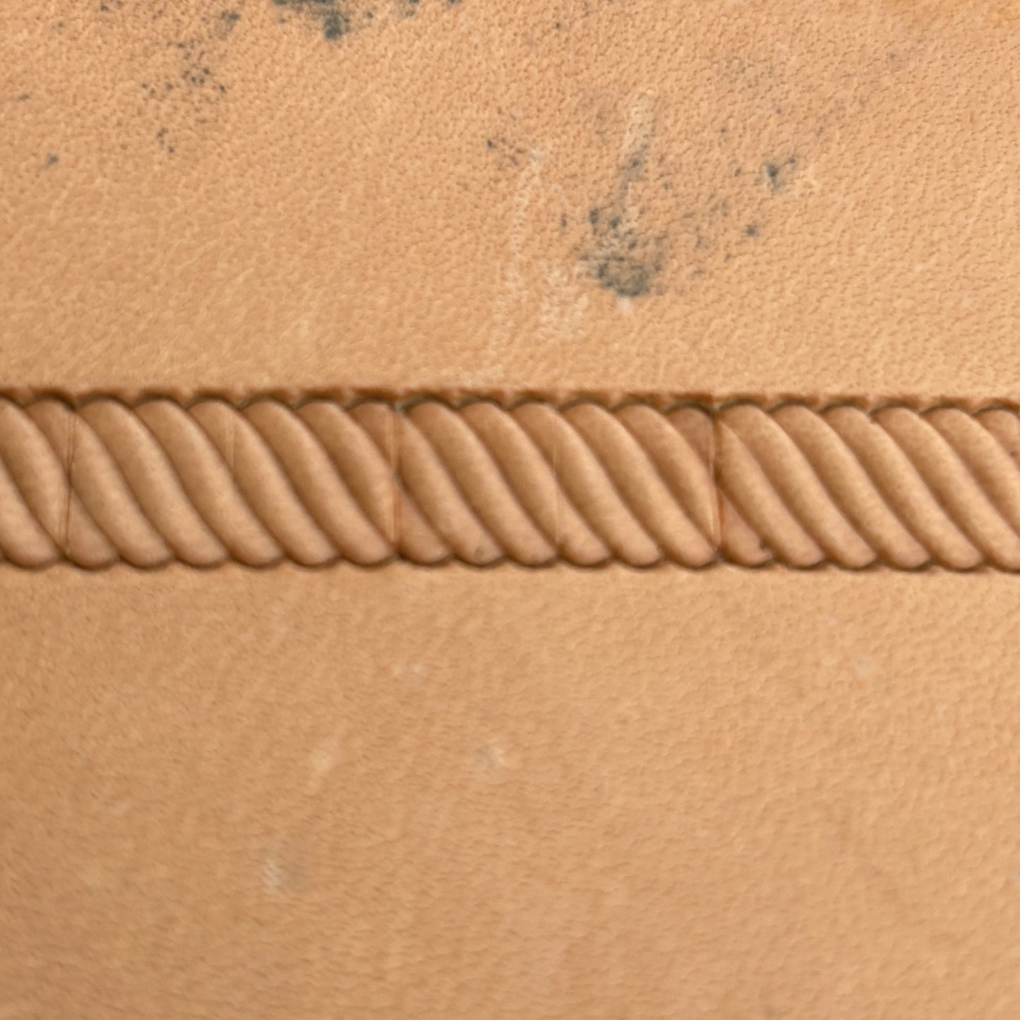 Stitches leather stamp LT057 — pattern imprint on veg-tan leather
