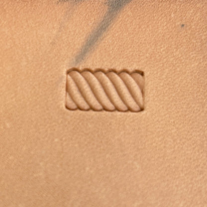 Stitches leather stamp LT057 — single impression on veg-tan leather