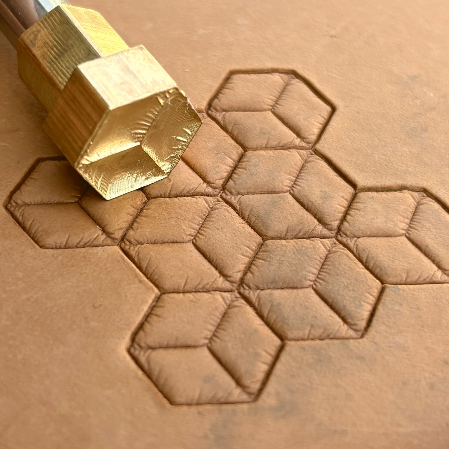 Geometric leather stamp LT062 — brass stamping tool with imprint on natural veg-tan leather
