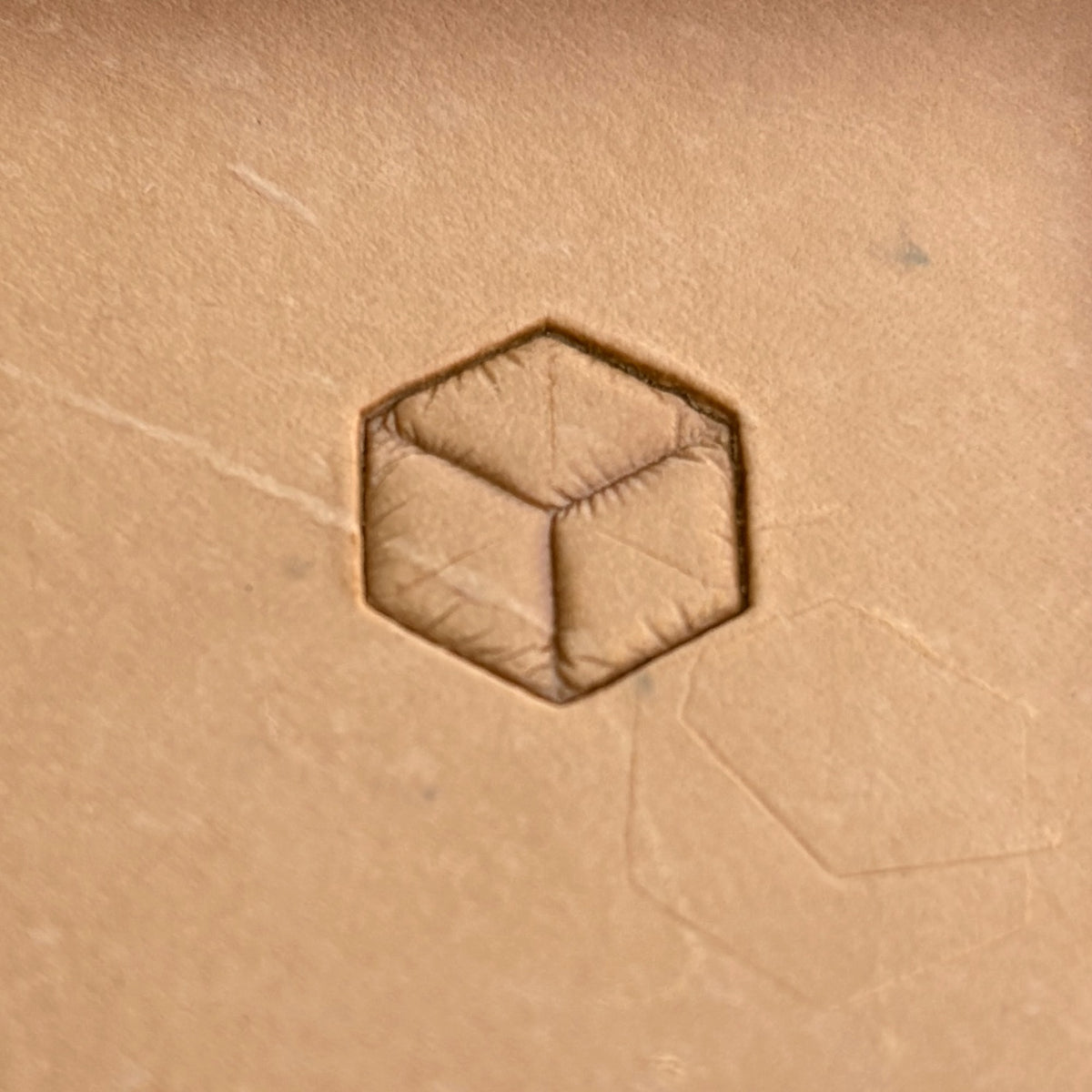 Geometric leather stamp LT062 — single impression on veg-tan leather