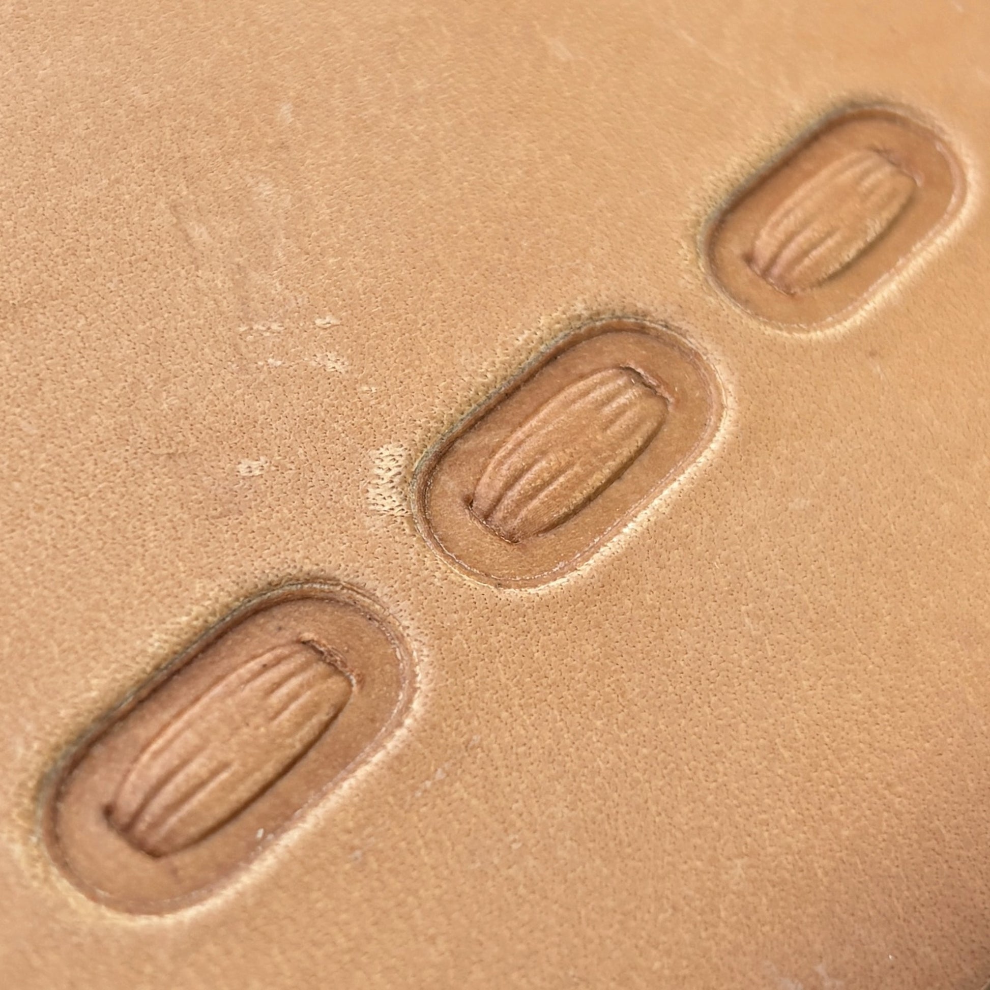 Oval Stitches leather stamp LT069 — pattern imprint on veg-tan leather