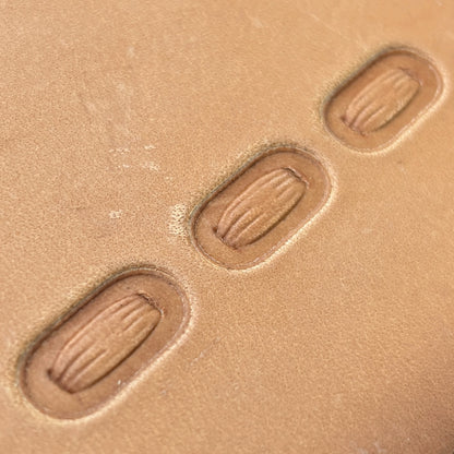 Oval Stitches leather stamp LT069 — pattern imprint on veg-tan leather
