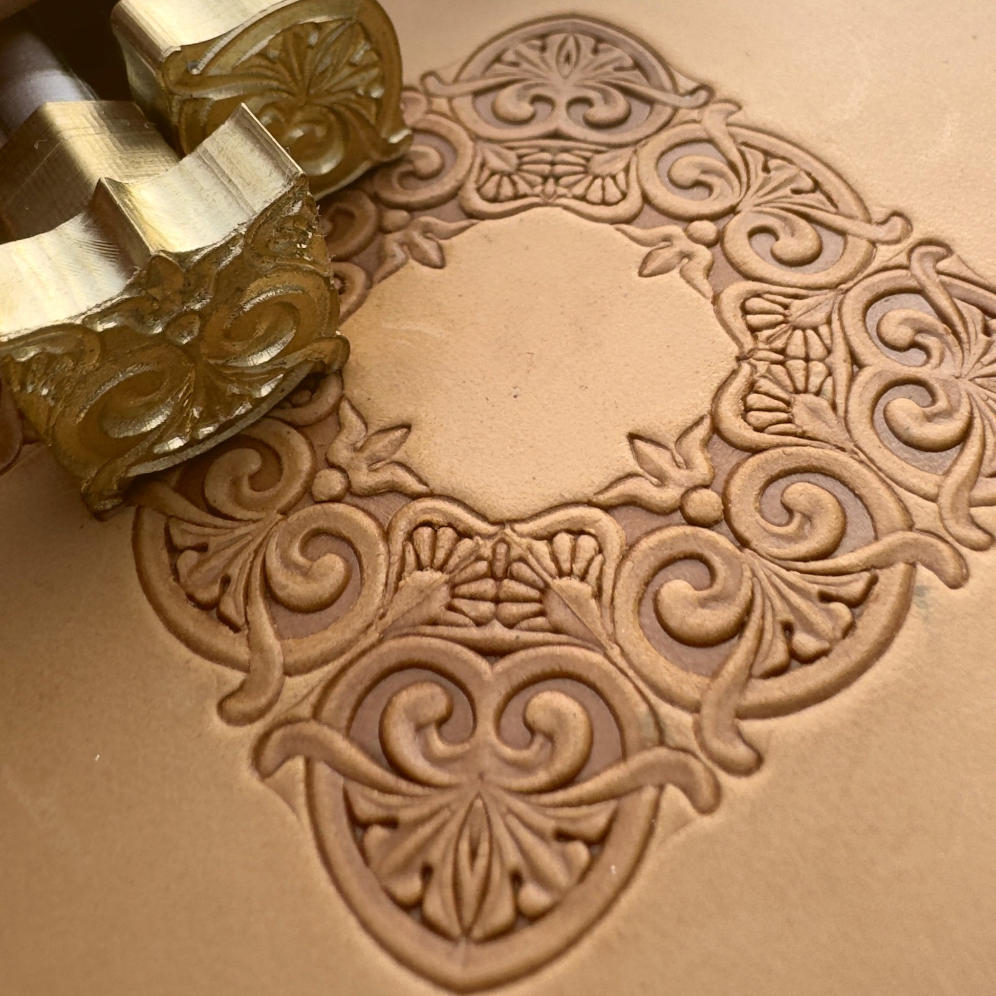 Scrollwork Border leather stamp LT071 — brass stamping tool with imprint on natural veg-tan leather