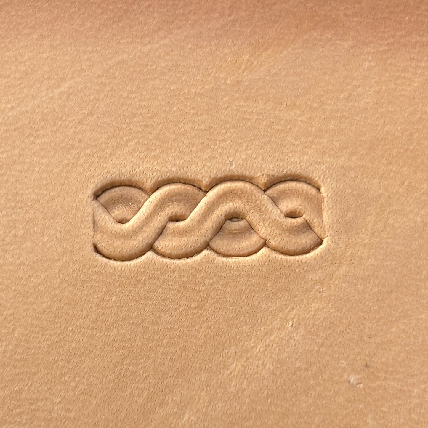 Interlaced Border leather stamp LT072 — single impression on veg-tan leather
