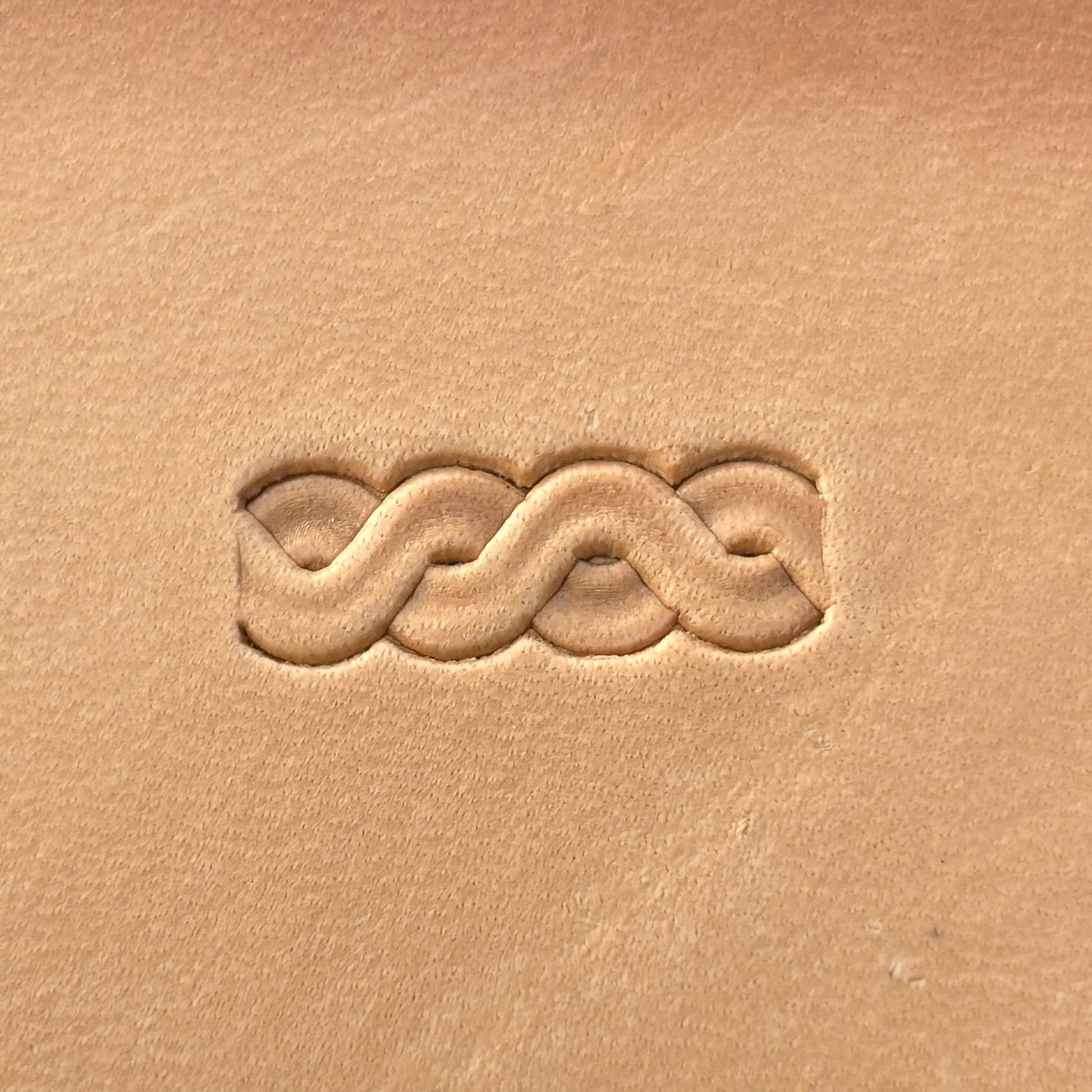 Interlaced Border leather stamp LT072 — single impression on veg-tan leather