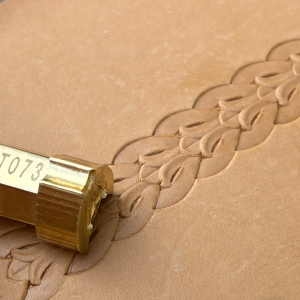 Border Leaf leather stamp LT073 — brass stamping tool with imprint on natural veg-tan leather