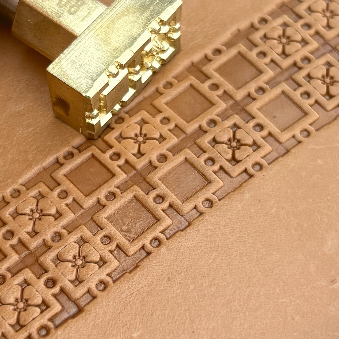 Geometric leather stamp LT081 — brass stamping tool with imprint on natural veg-tan leather