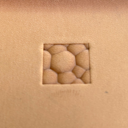 Bubble Style leather stamp LT084 — single impression on veg-tan leather