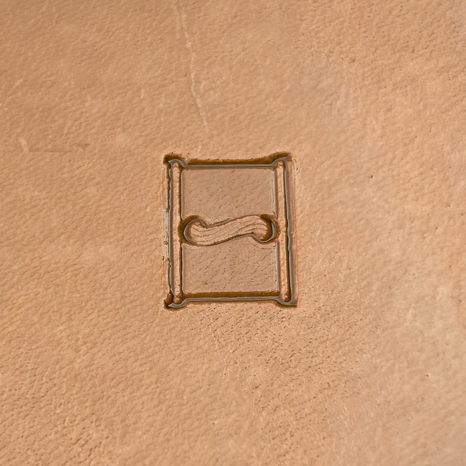 Boxed Line Stitches leather stamp LT087 — single impression on veg-tan leather