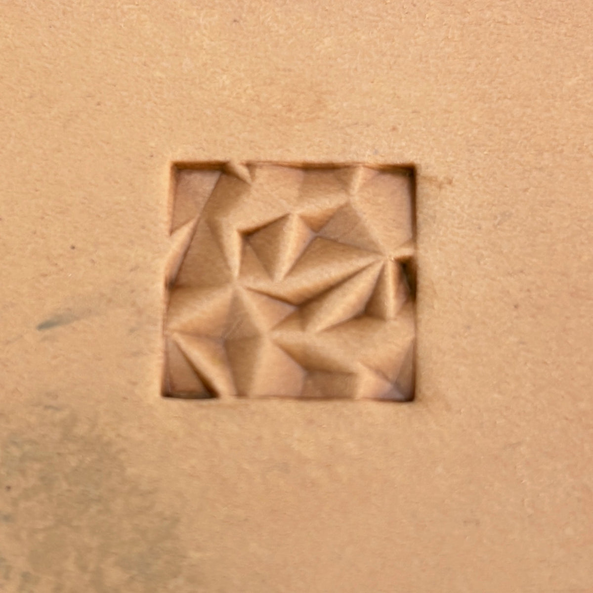 Geometric leather stamp LT089 — single impression on veg-tan leather