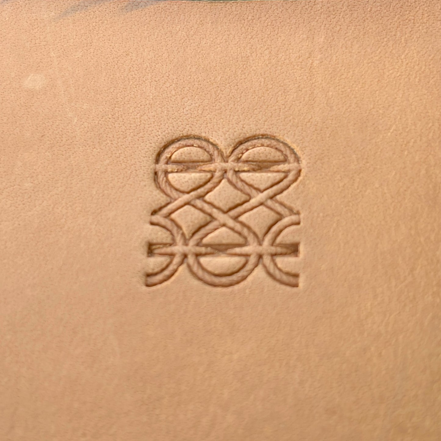 Interlocking Lines leather stamp LT090 — single impression on veg-tan leather