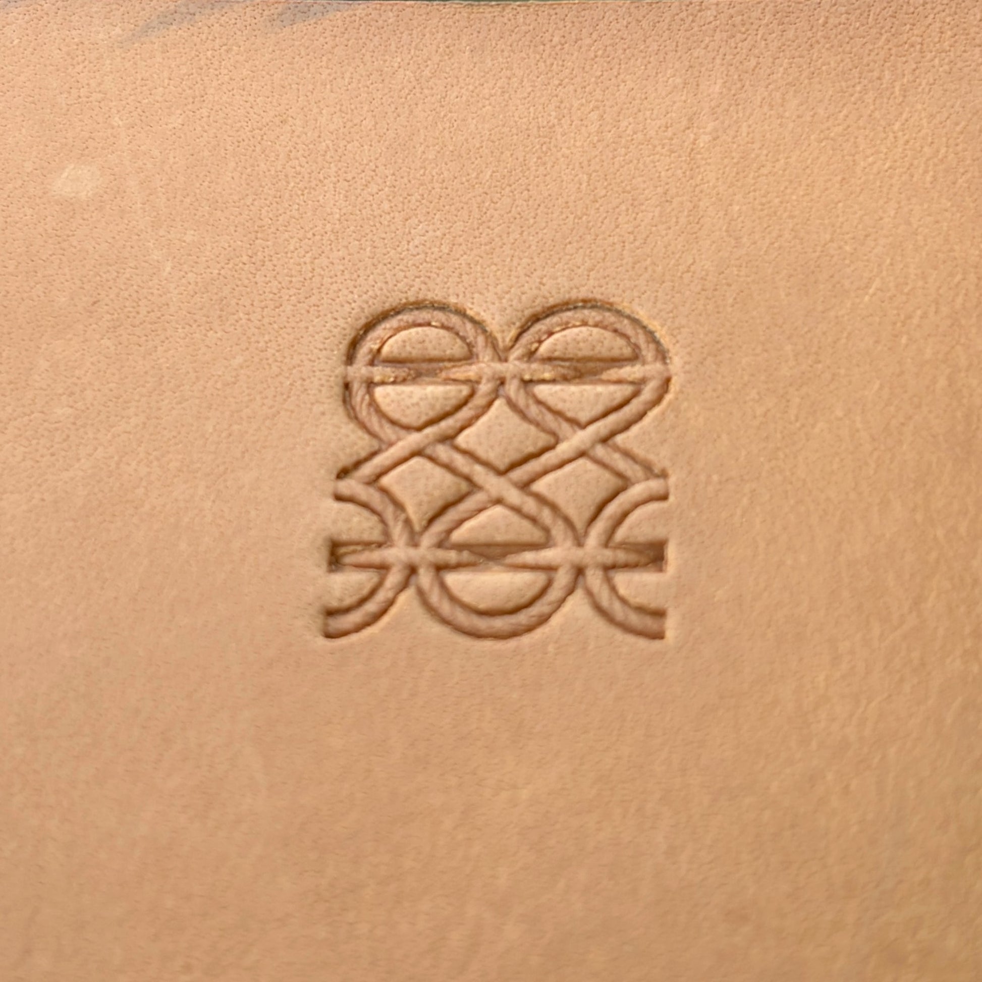 Interlocking Lines leather stamp LT090 — single impression on veg-tan leather