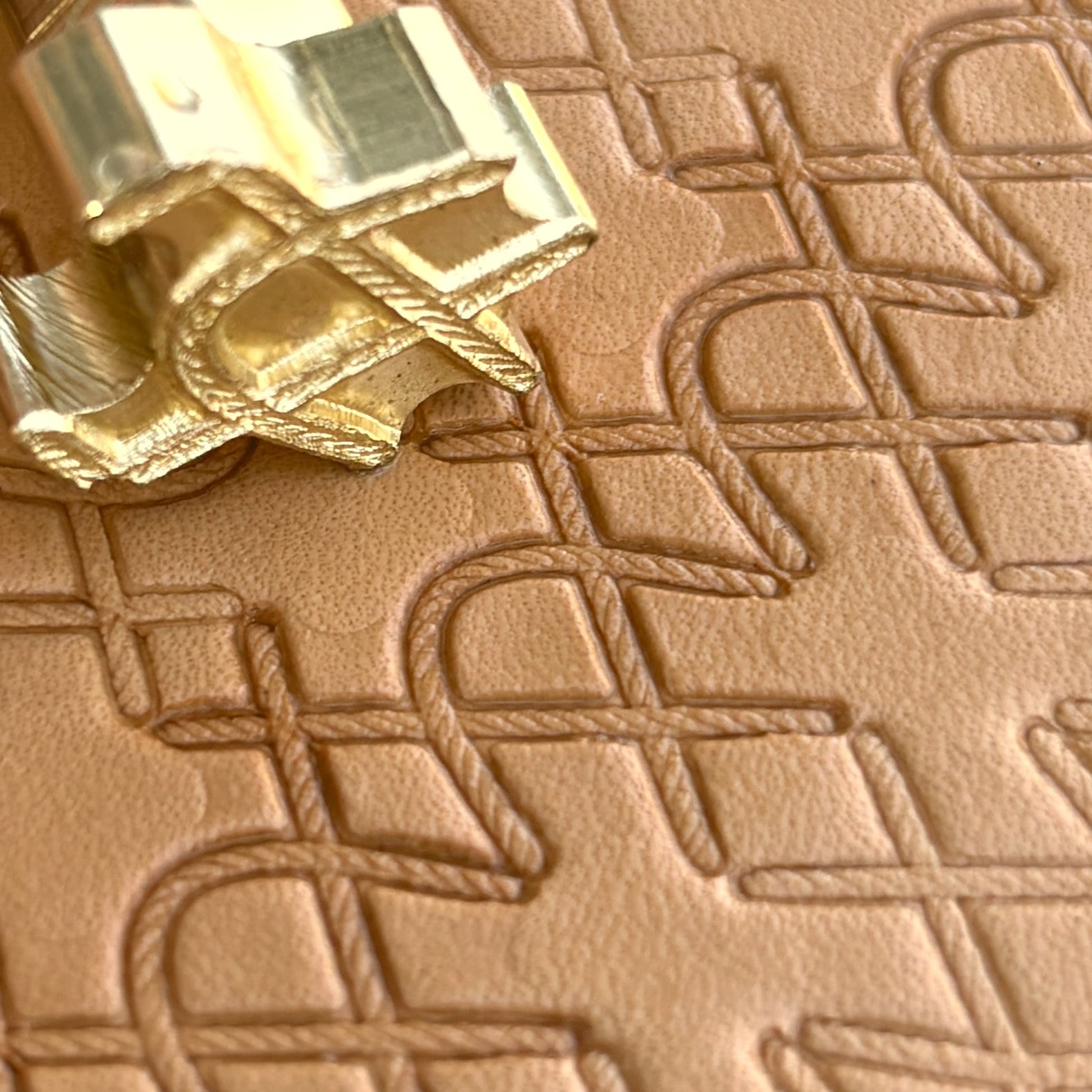 Geometric leather stamp LT091 — brass stamping tool with imprint on natural veg-tan leather