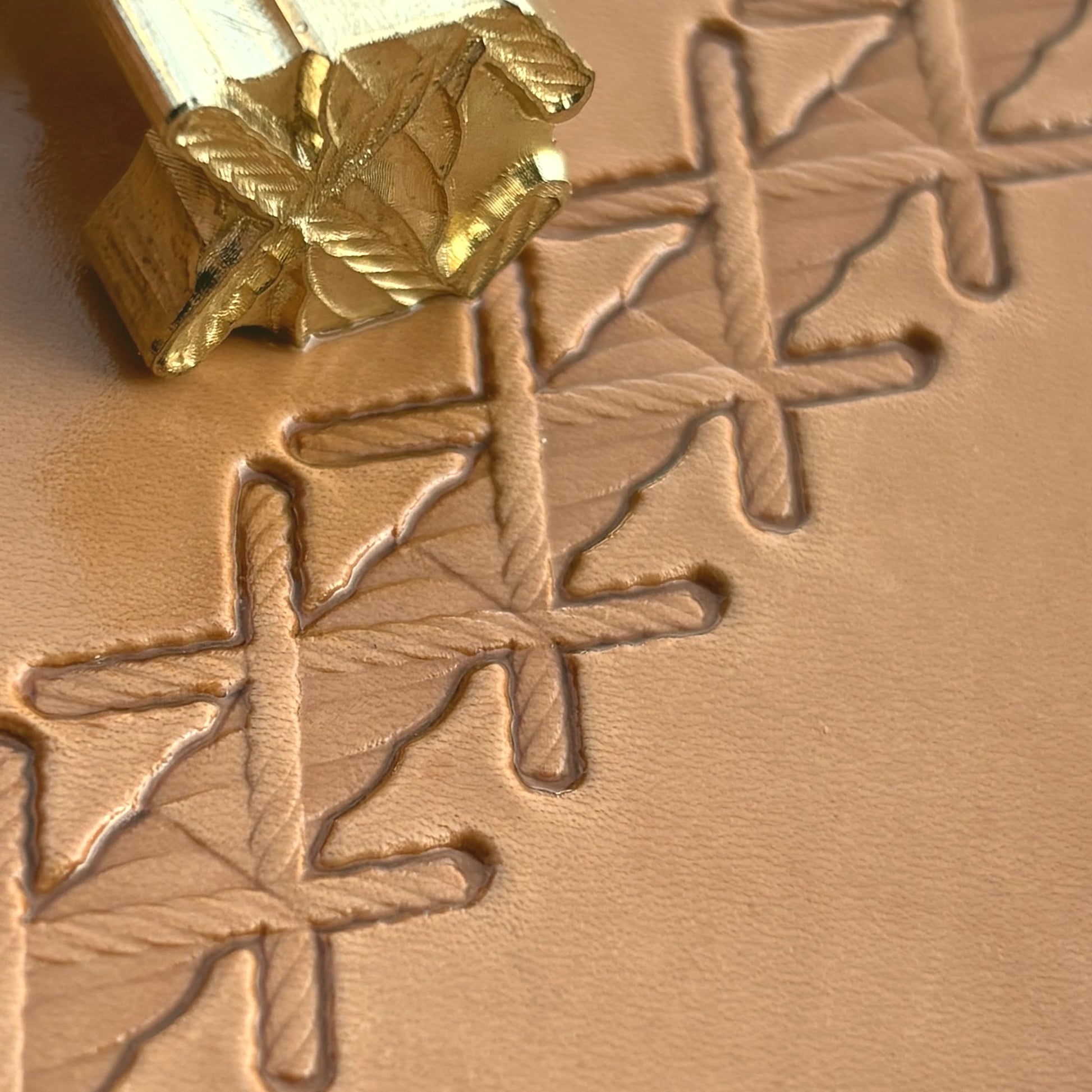 Stitches leather stamp LT092 — brass stamping tool with imprint on natural veg-tan leather