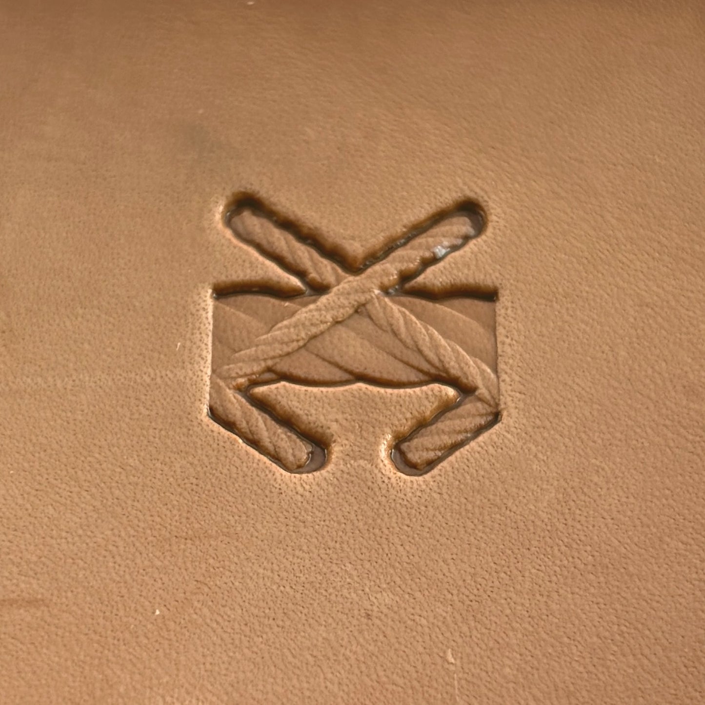 Stitches leather stamp LT092 — single impression on veg-tan leather