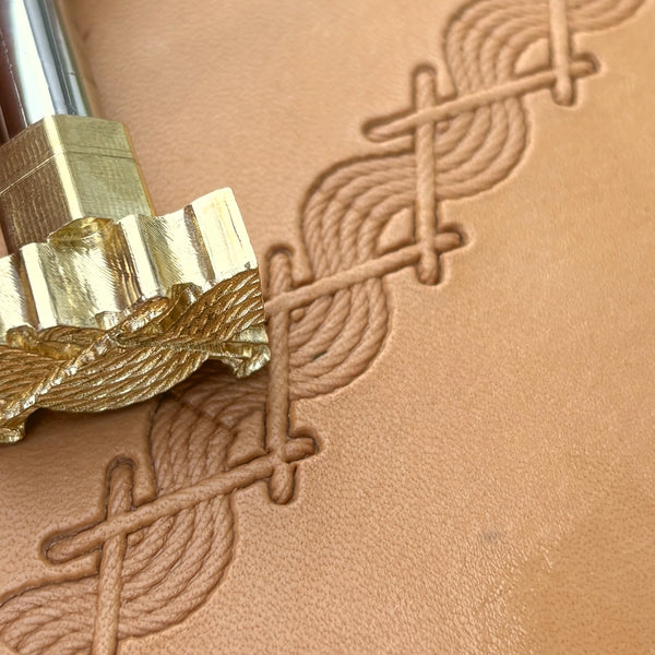 Twisted Line Stitches leather stamp LT093 — brass stamping tool with imprint on natural veg-tan leather