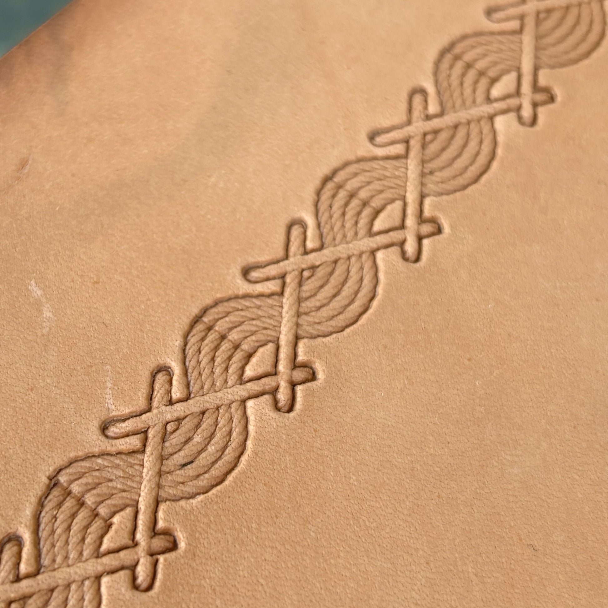 Twisted Line Stitches leather stamp LT093 — single impression on veg-tan leather