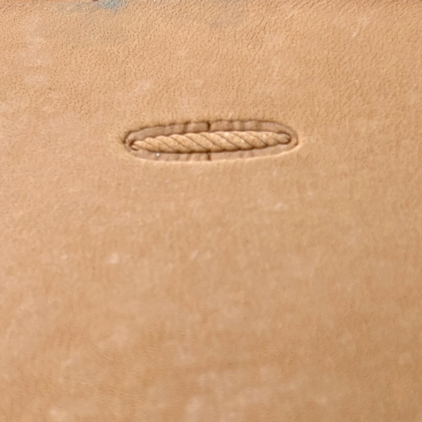 Oval Style Stitches leather stamp LT095 — single impression on veg-tan leather