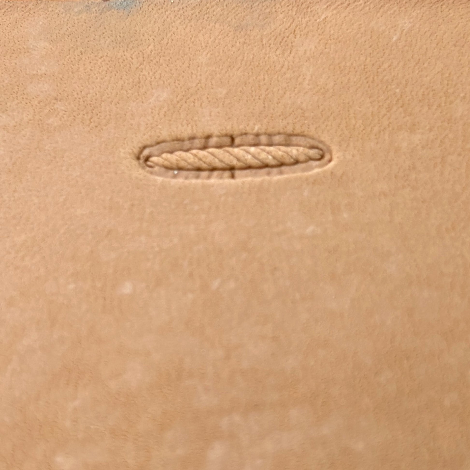 Oval Style Stitches leather stamp LT095 — single impression on veg-tan leather
