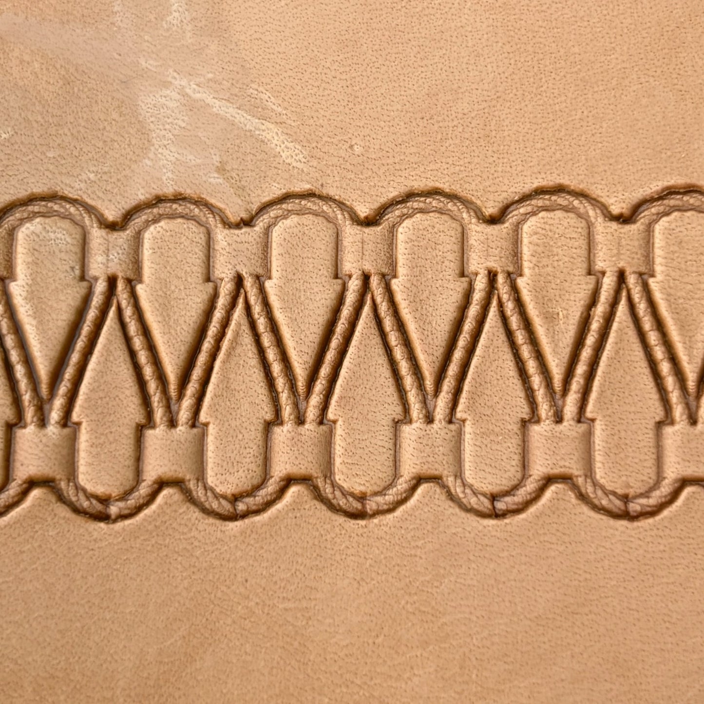 Double Loop Stitches leather stamp LT097 — pattern imprint on veg-tan leather
