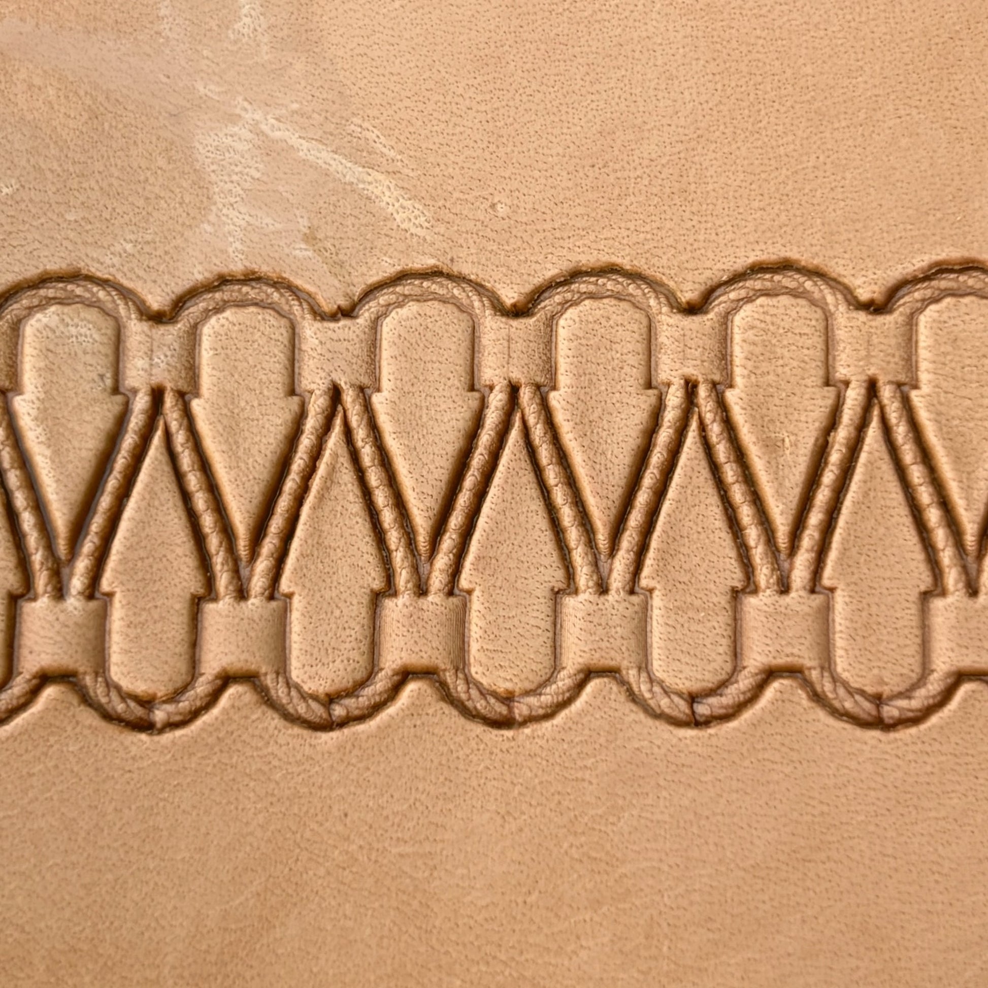 Double Loop Stitches leather stamp LT097 — pattern imprint on veg-tan leather
