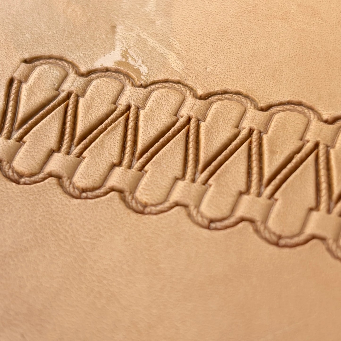 Double Loop Stitches leather stamp LT097 — single impression on veg-tan leather