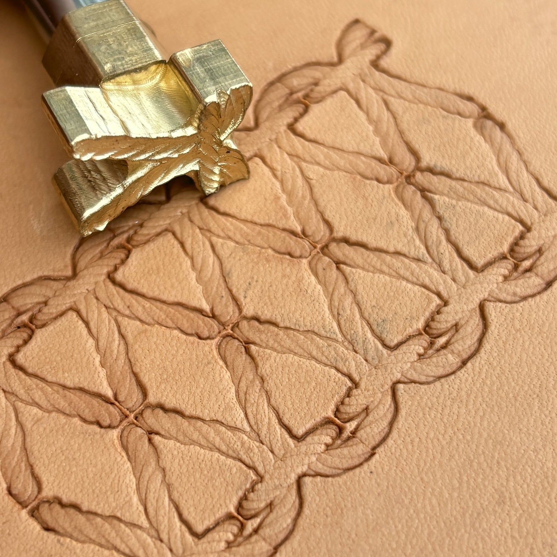 Stitches leather stamp LT098 — brass stamping tool with imprint on natural veg-tan leather
