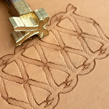 Stitches leather stamp LT098 — brass stamping tool with imprint on natural veg-tan leather