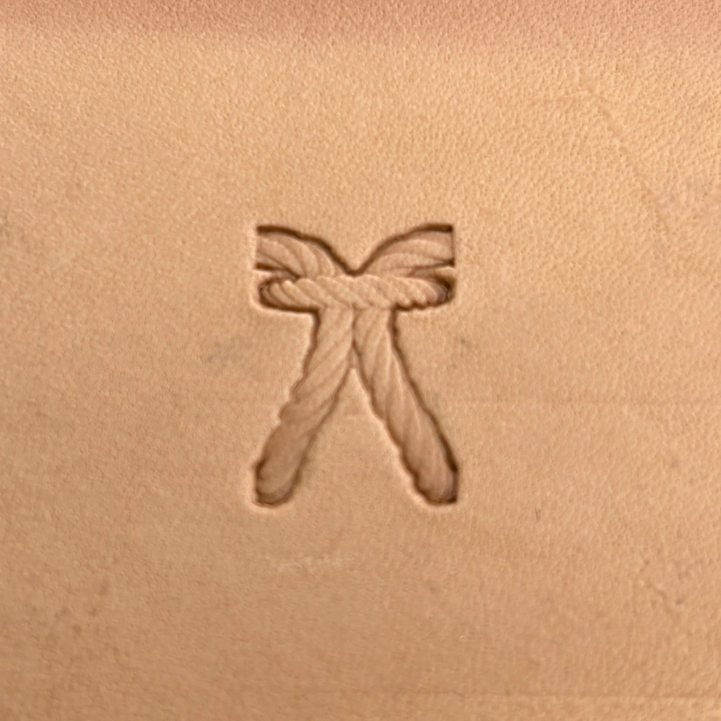 Stitches leather stamp LT098 — single impression on veg-tan leather