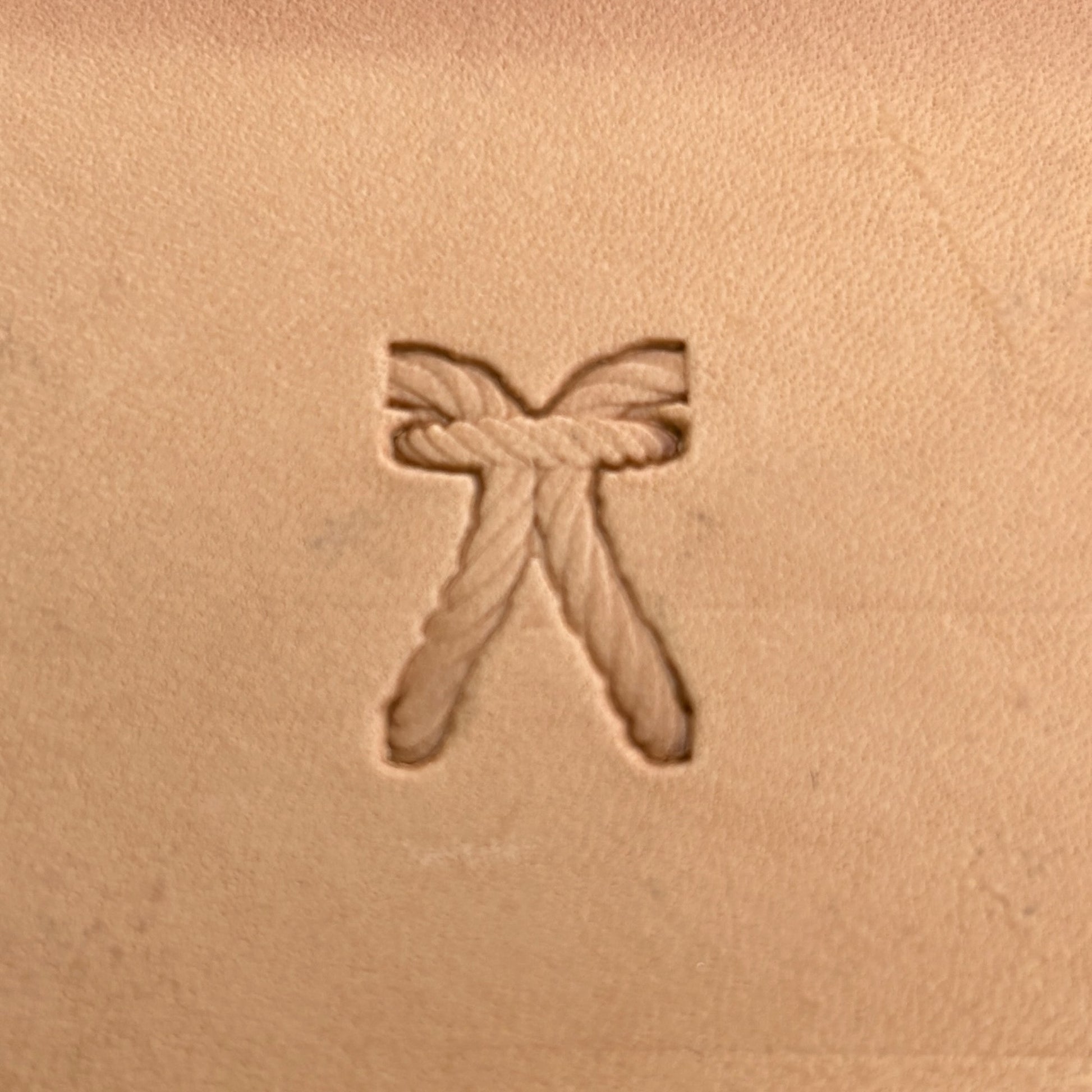 Stitches leather stamp LT098 — single impression on veg-tan leather