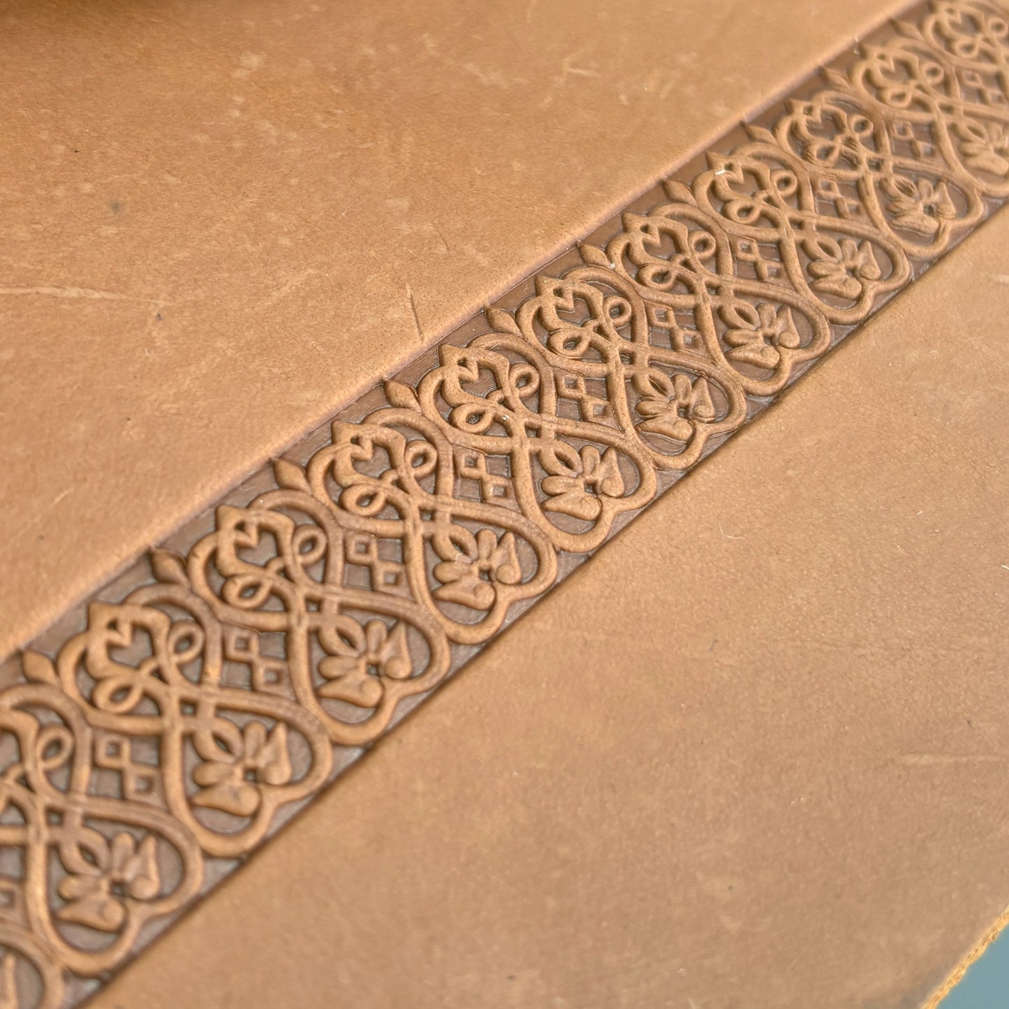 Floral Loop leather stamp LT108 — pattern imprint on veg-tan leather