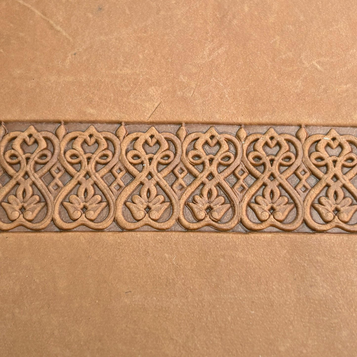 Floral Loop leather stamp LT108 — pattern imprint on veg-tan leather